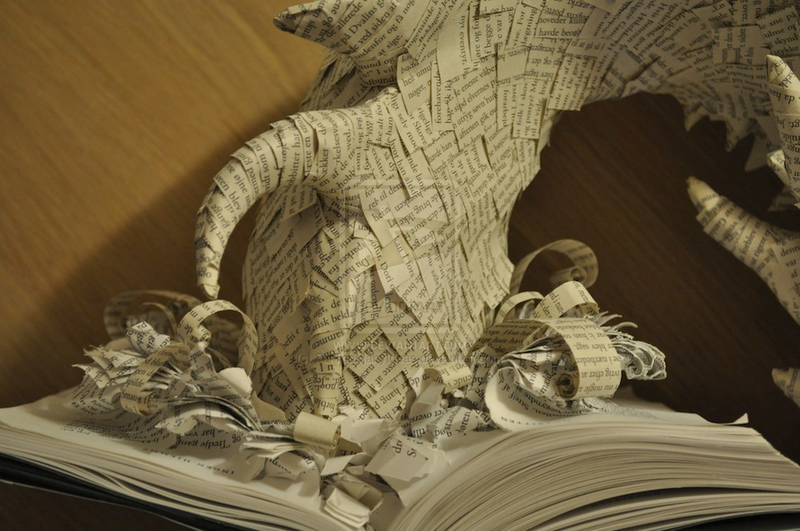 Illustration for article titled Artist Turns The Hobbit Book Into Paper Sculpture Of Smaug
